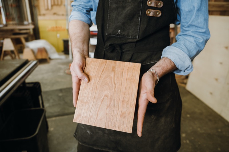 Selecting wood for a custom furniture project at Flatow Furniture