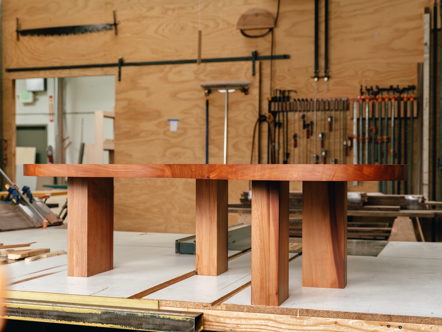 Madrone coffee table showing four chunky through-mortise legs and organic top shape