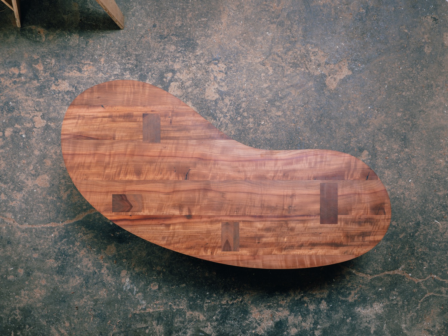 Full overhead view of madrone coffee table with organic bean-shaped top