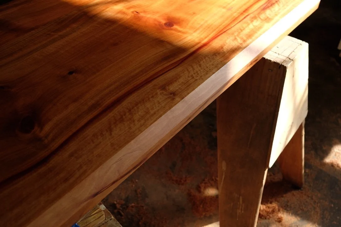 Close-up of a madrone table on sawhorses